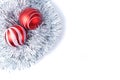 Flat lay with Christmas toys - silver tinsel and two red balls for decorating the Christmas tree. Copy space Royalty Free Stock Photo