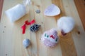 Flat lay Christmas tree ornaments DIY. Stiffed toy with handmade embroidery needlework and decorative element. Cone and