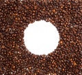Flat lay, coffee beans frame with white circle in the center, isolated, copy space Royalty Free Stock Photo