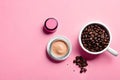 Flat lay of coffee beans with coffee powder cosmetics isolated on pink background