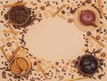 Flat lay coffee beans, teapot, oatmeal cookies and chocolate biscuit with spice on beige background