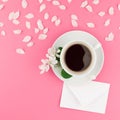 Flat lay of coffee, letter mockup and white petals Royalty Free Stock Photo