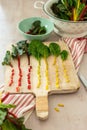 Flat lay of colorful cut stems of Chard vegetables on a wooden chopping board Royalty Free Stock Photo