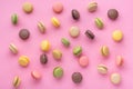 flat lay of colorful french macaroon cookies like background, dessert concept of pastel pink color