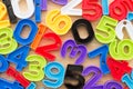 Flat lay of colorful numbers kid learning toy on wooden background. Education, back to school and mathematics concept Royalty Free Stock Photo