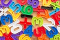 Flat lay of colorful numbers and mathematical symbols on wooden background. Education, back to school and mathematics concept Royalty Free Stock Photo