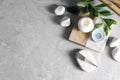 Flat lay composition with acupuncture needles on light grey marble table, space for text