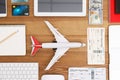 Flat lay composition with airplane model and tablet