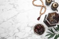 Flat lay composition with Arabic lantern on white marble table . Space for text Royalty Free Stock Photo