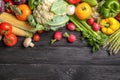 Flat lay composition with assortment of fresh vegetables on wooden table