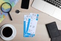 Flat lay composition with avia tickets and passport on wooden table. Travel agency concept