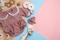 Flat lay composition with baby clothes and accessories on color background. Space for text Royalty Free Stock Photo