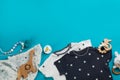 Flat lay composition with baby clothes and accessories on light blue, space for text Royalty Free Stock Photo