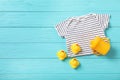 Flat lay composition with baby clothes and accessories on wooden background. Royalty Free Stock Photo