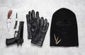 Flat lay composition with balaclava and weapons on light table Royalty Free Stock Photo