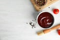 Flat lay composition with barbecue sauce on white wooden background. Royalty Free Stock Photo