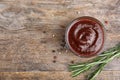 Flat lay composition with barbecue sauce on wooden background. Royalty Free Stock Photo