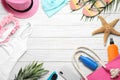 Flat lay composition with beach accessories on white wooden background Royalty Free Stock Photo