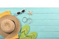 Flat lay composition with beach accessories on wooden background. Royalty Free Stock Photo