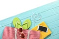 Flat lay composition with beach accessories on wooden background. Royalty Free Stock Photo