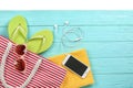 Flat lay composition with beach accessories on wooden background Royalty Free Stock Photo