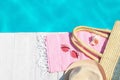 Flat lay composition with beach accessories near swimming pool. Space for text Royalty Free Stock Photo