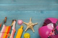 Flat lay composition with beach ball on light blue wooden background. Space for text Royalty Free Stock Photo