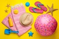 Flat lay composition with beach ball and sand toys on yellow background Royalty Free Stock Photo