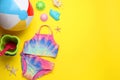 Flat lay composition with beach ball and sand toys on yellow background, space for text Royalty Free Stock Photo