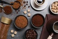 Flat lay composition with beans, instant and ground coffee on grey table Royalty Free Stock Photo