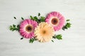 Flat lay composition with beautiful bright gerbera flowers Royalty Free Stock Photo