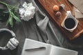 Flat lay composition in bed, with coffee and notepad. Royalty Free Stock Photo
