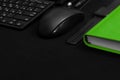 Flat lay composition with black pen, computer keyboard, smartphone, smart watch, leather wallet and bright green notebook on dark Royalty Free Stock Photo