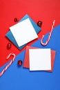 Flat lay composition with blank greeting cards and Christmas decor on color background, space for text Royalty Free Stock Photo