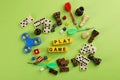 Flat lay composition of blocks with words Play Game on green background