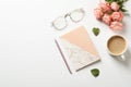 Flat lay composition with book, flowers and cup of coffee