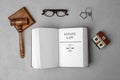 Flat lay composition with book, gavel and house model Royalty Free Stock Photo