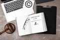 Flat lay composition with book, gavel and laptop Royalty Free Stock Photo