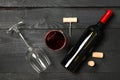 Flat lay composition with bottle of wine, glasses and corkscrew on wooden background Royalty Free Stock Photo