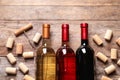 Flat lay composition with bottles of wine and corks on Royalty Free Stock Photo