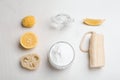 Flat lay composition with bowl of baking soda, lemon and cleaning items