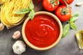 Flat lay composition with bowl of tasty tomato sauce Royalty Free Stock Photo