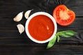 Flat lay composition with bowl of tomato sauce Royalty Free Stock Photo