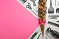 Flat lay composition with braid, hairdresser`s tools and space for text Royalty Free Stock Photo