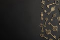 Flat lay composition with bronze vintage ornate keys on dark background