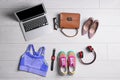 Flat lay composition with business supplies and sport equipment on white wooden floor. Concept of balance between work and life Royalty Free Stock Photo