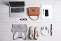 Flat lay composition with business supplies and sport equipment on white wooden floor. Concept of balance between work and life Royalty Free Stock Photo