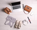 Flat lay composition with business supplies and sport equipment on white wooden floor. Concept of balance between work and life Royalty Free Stock Photo