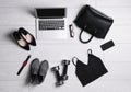 Flat lay composition with business supplies and sport equipment on white wooden floor. Concept of balance between work and life Royalty Free Stock Photo