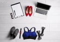 Flat lay composition with business supplies and sport equipment on white wooden floor. Concept of balance between work and life Royalty Free Stock Photo